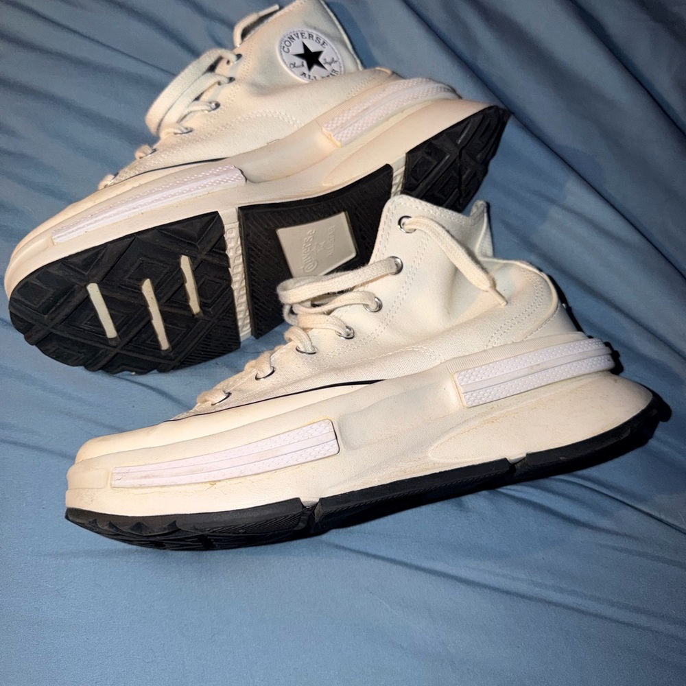 Converse Cream platform hi-tops.